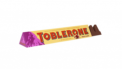 Шоколад  "Toblerone" молочный с медово-миндальной нугой с изюмом и орехом, 100гр